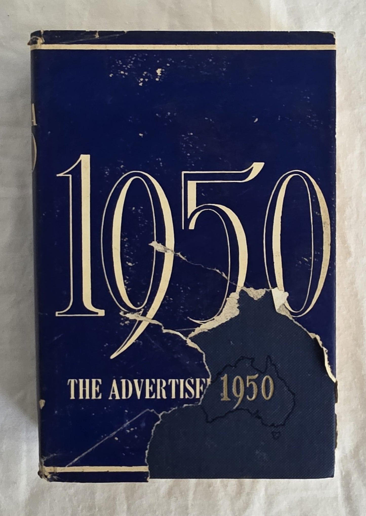 Vintage book cover from 1950 with 'The Advertiser' branding on a textured white background