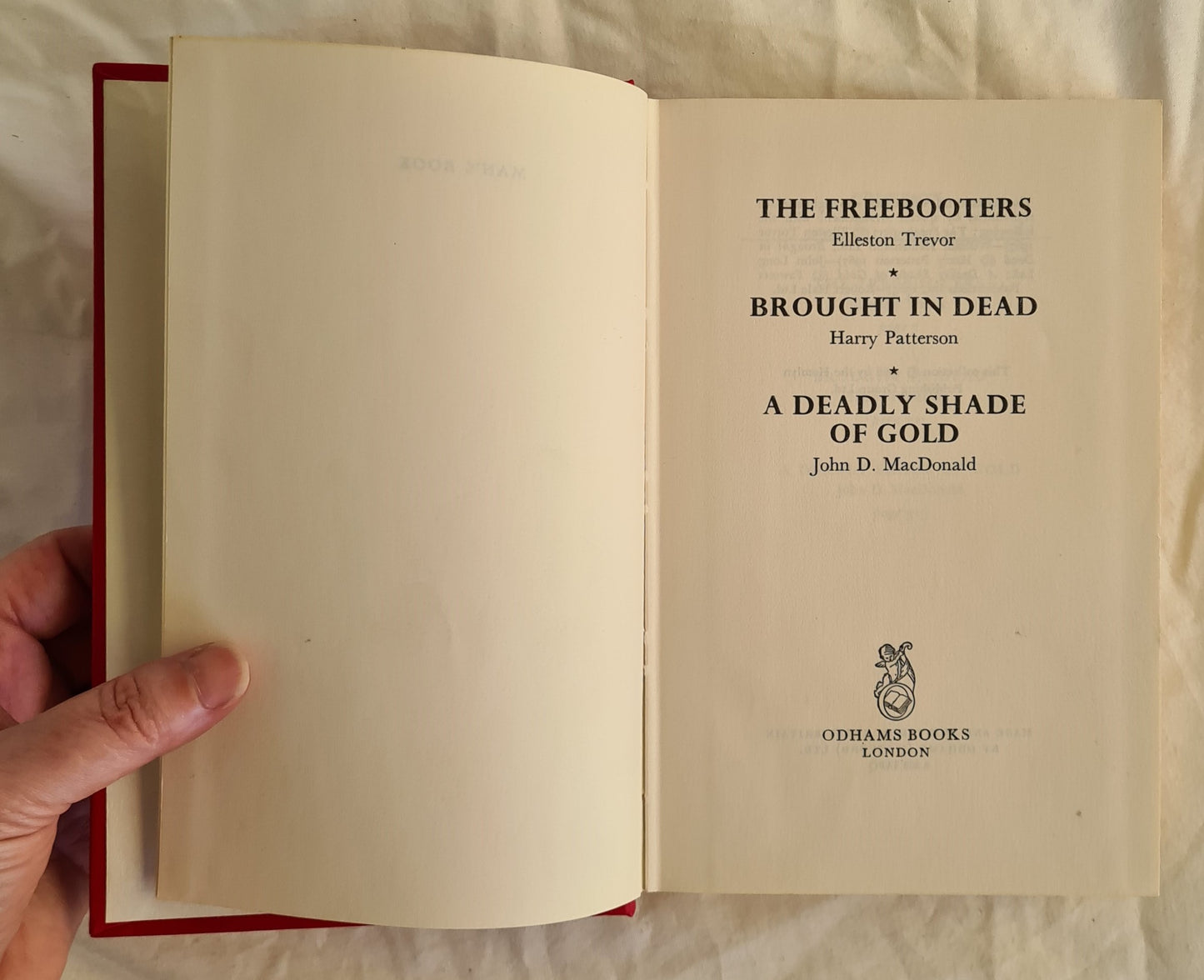 Man’s Book  The Freebooters by Elleston Trevor Brought in Dead by Harry Patterson A Deadly Shade of Gold by John D. Macdonald