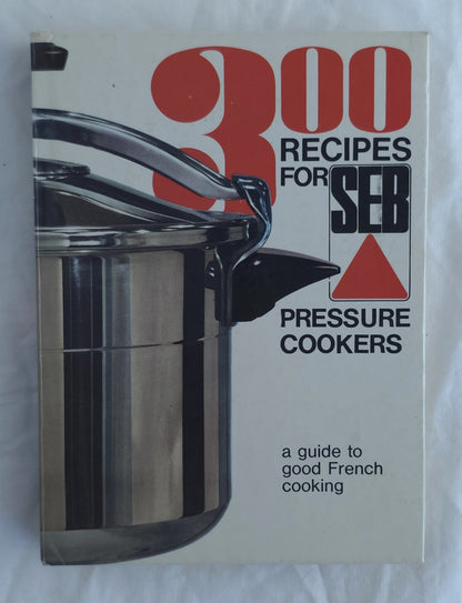 A vintage cookbook titled '300 Recipes for Seb Pressure Cookers' with a cover showing a stainless steel pressure cooker. The cover has a cream background with bold red and black text.