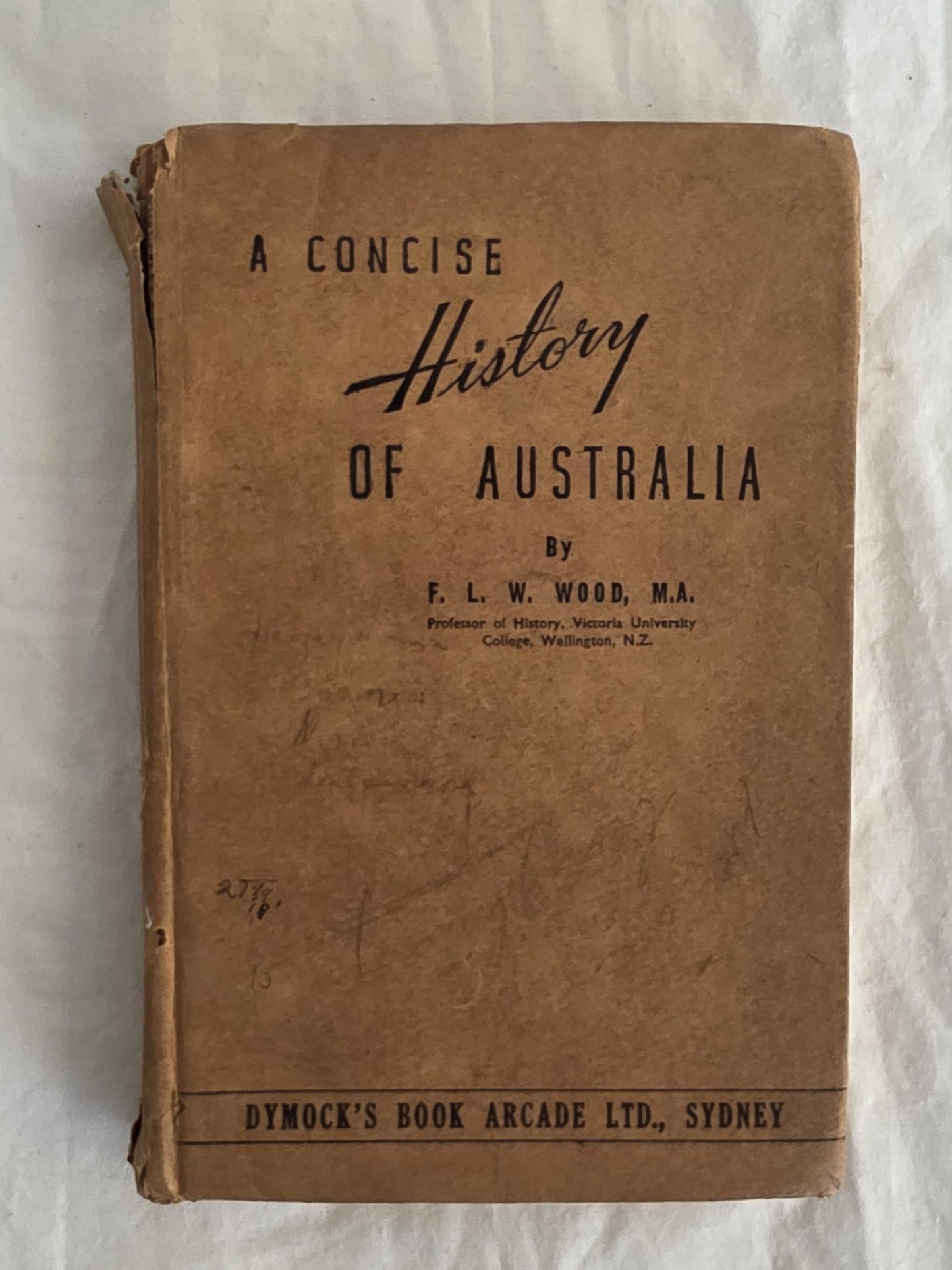 Vintage book titled 'A Concise History of Australia' by F. L. W. Wood on a textured white background