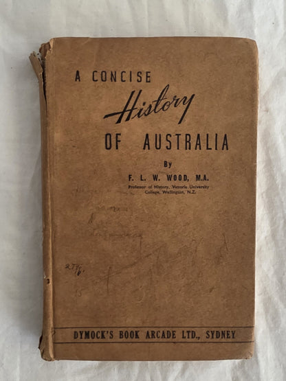 Vintage book titled 'A Concise History of Australia' by F. L. W. Wood on a textured white background