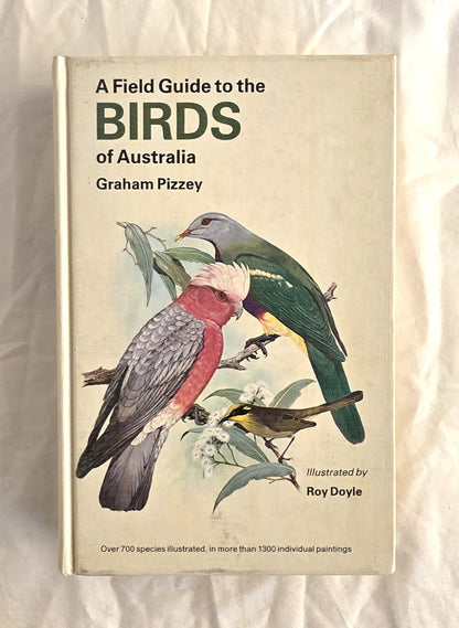 Book titled 'A Field Guide to the Birds of Australia' by Graham Pizzey on a textured beige background.