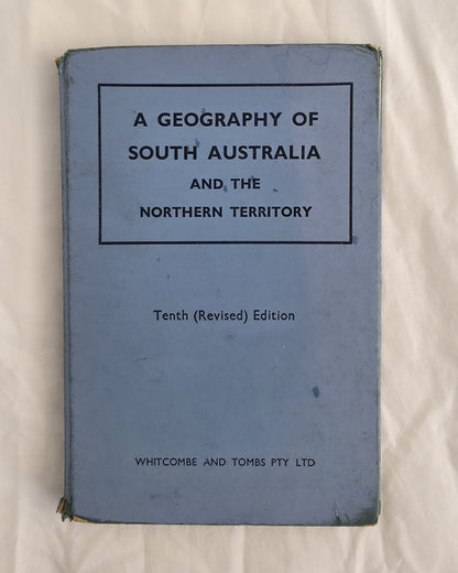 Blue book titled 'A Geography of South Australia and the Northern Territory' on a white background