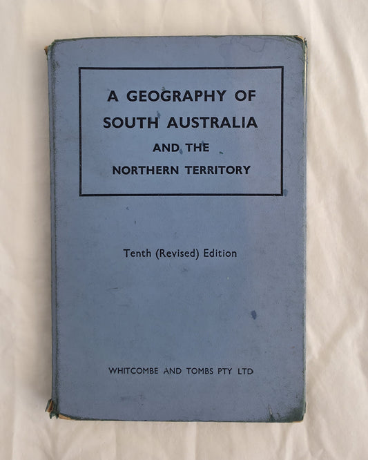 Blue book titled 'A Geography of South Australia and the Northern Territory' on a white background