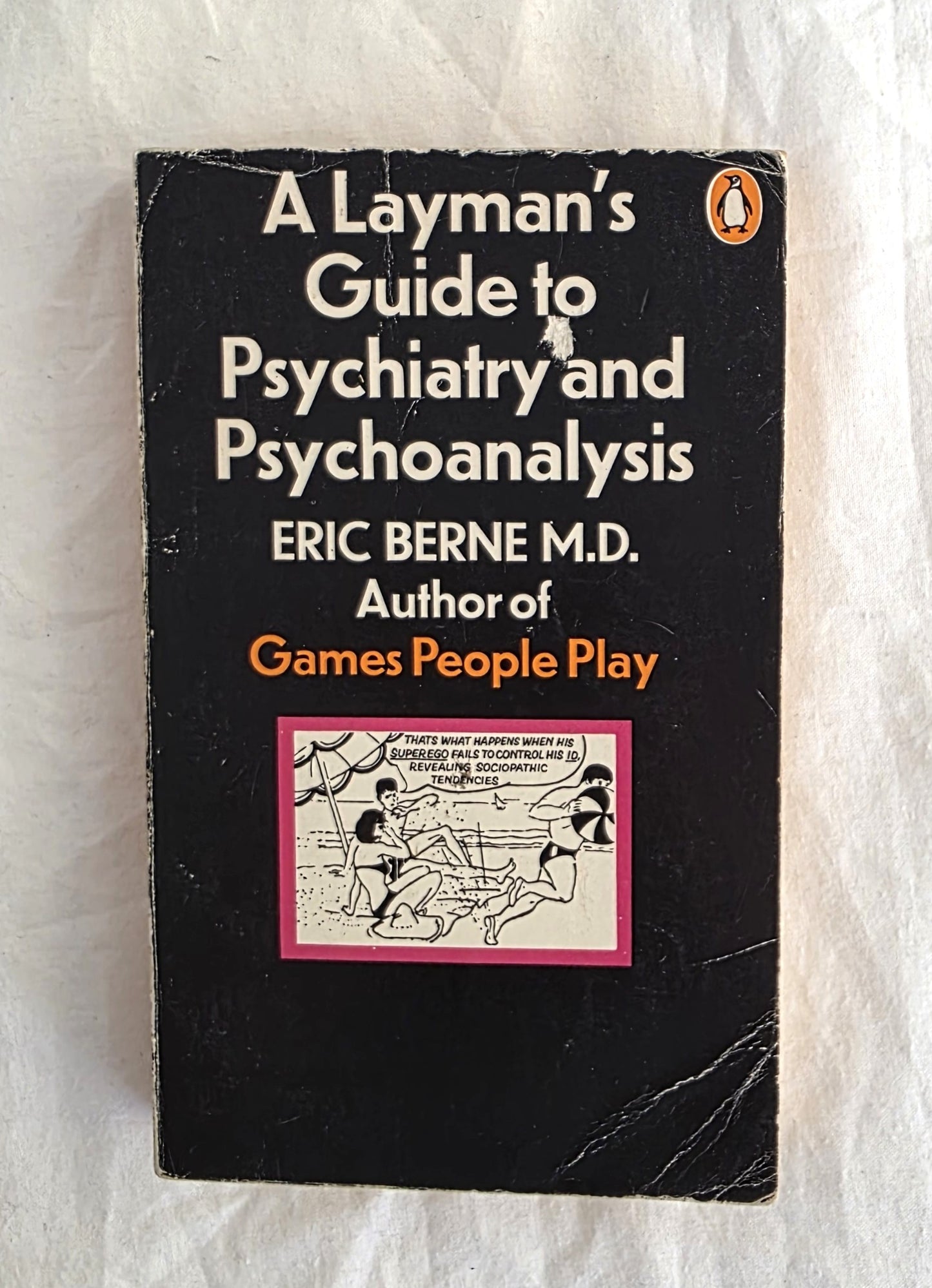 Book cover of 'A Layman's Guide to Psychiatry and Psychoanalysis' by Eric Berne on a textured white background