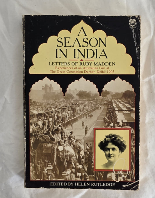 Book cover of 'A Season in India: Letters of Ruby Madden' with a historical photograph and text.