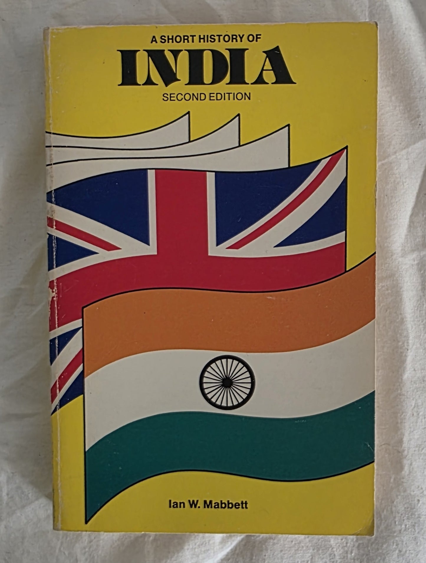 Book cover of 'A Short History of India' with British and Indian flags on a yellow background