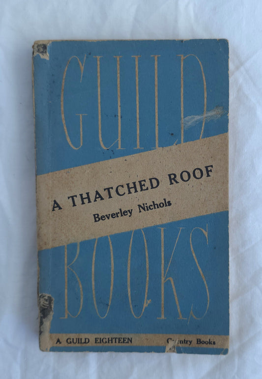 Book cover of 'A Thatched Roof' by Beverley Nichols with blue and brown design on a white background