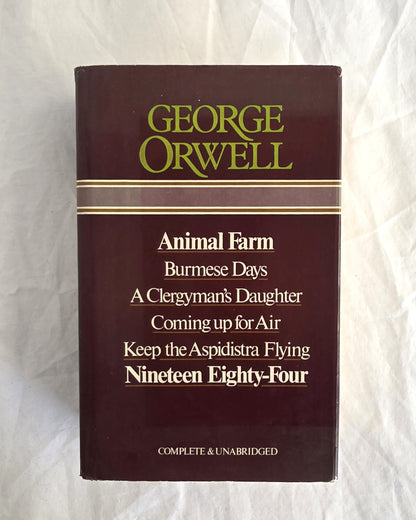 Book collection by George Orwell on a white background