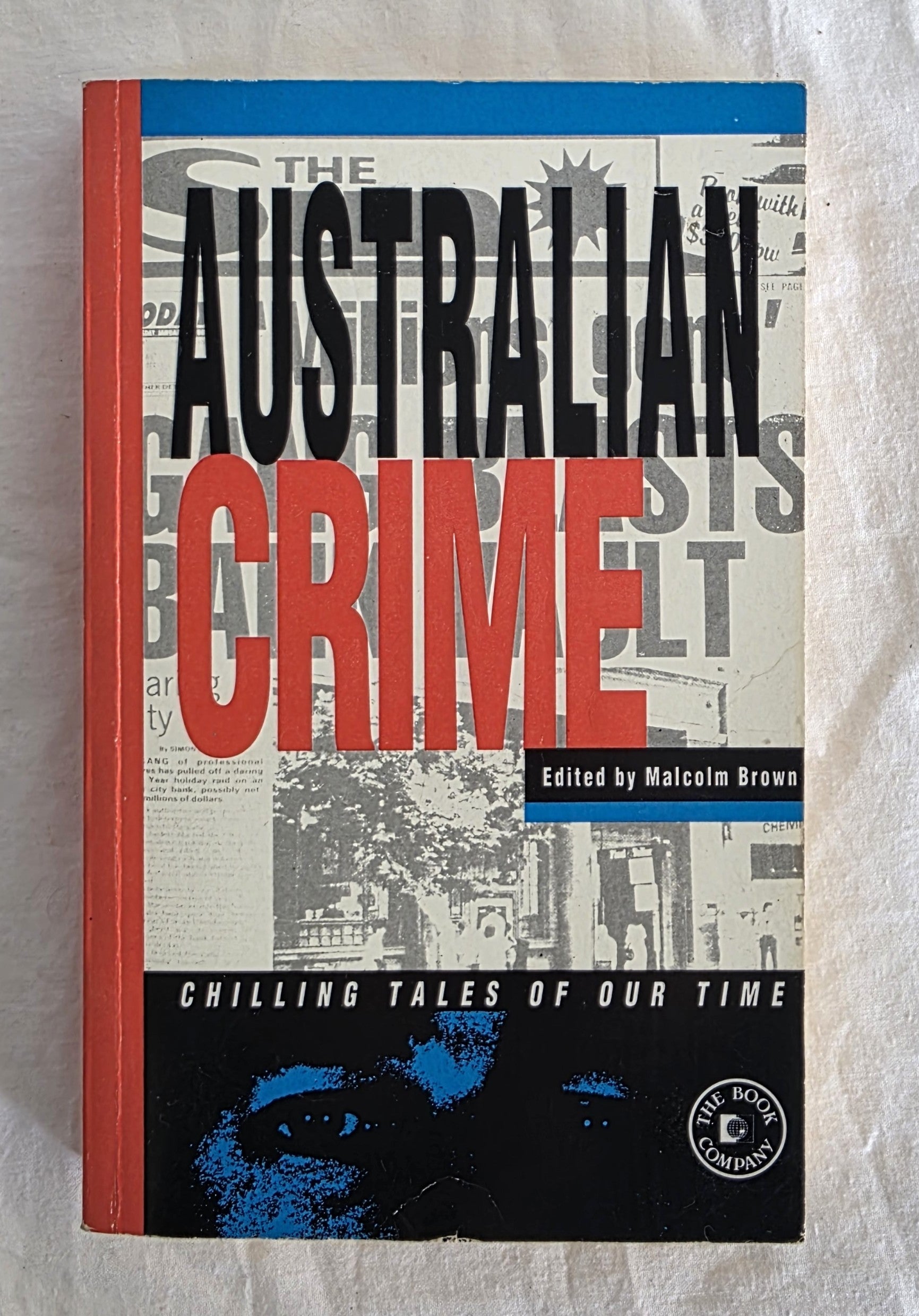 Book titled 'The Australian Crime' with a red and black cover on a white background