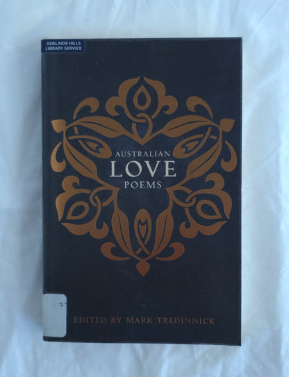 Book titled 'Australian Love Poems' with decorative cover on a white background
