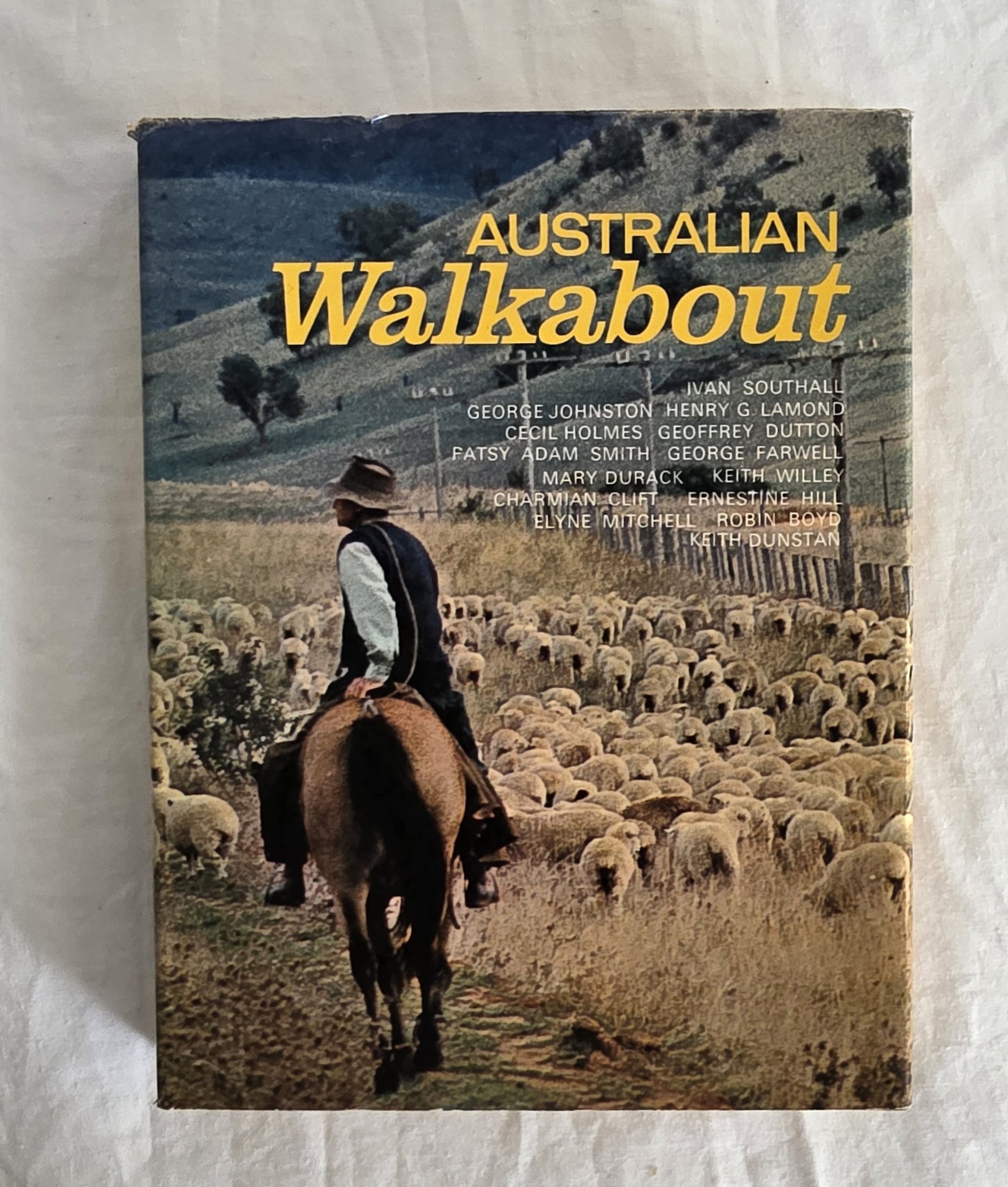Book titled 'Australian Walkabout' with a cover featuring a shepherd and sheep on horseback.