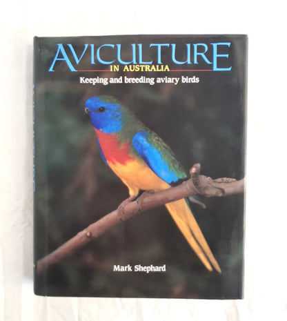 Book titled 'Aviculture in Australia' with a colorful parrot on the cover.