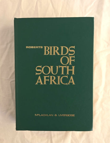 Book titled 'Birds of South Africa' by Roberts on a plain background