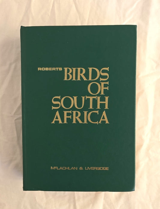 Book titled 'Birds of South Africa' by Roberts on a plain background