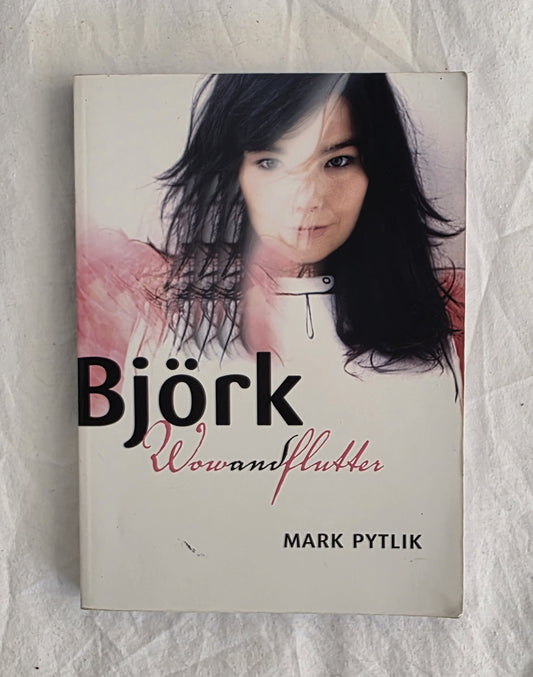 Book cover of 'Wowanflutter' by Bjärk with a photo of the artist on a textured background