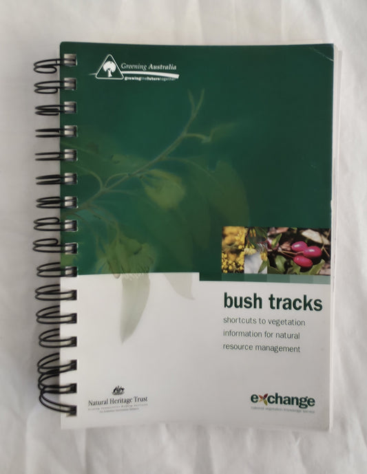 Spiral-bound book titled 'bush tracks' with green cover and white text section on a white background