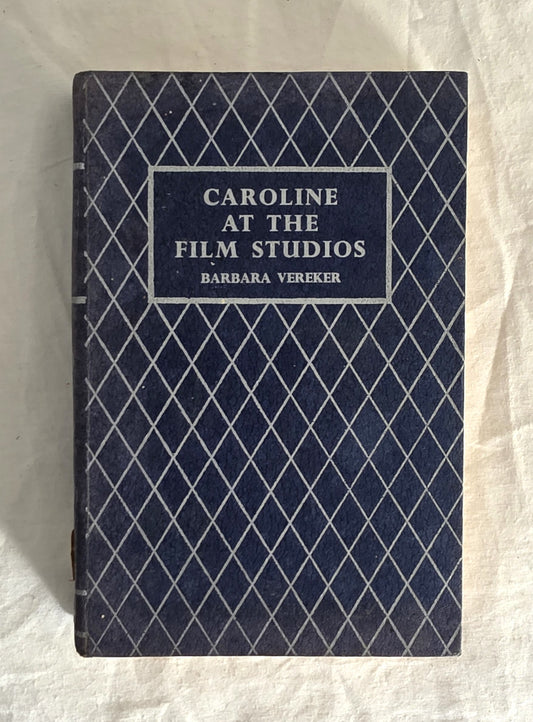Book titled 'Caroline at the Film Studios' by Barbara Vereker with a blue diamond pattern cover.