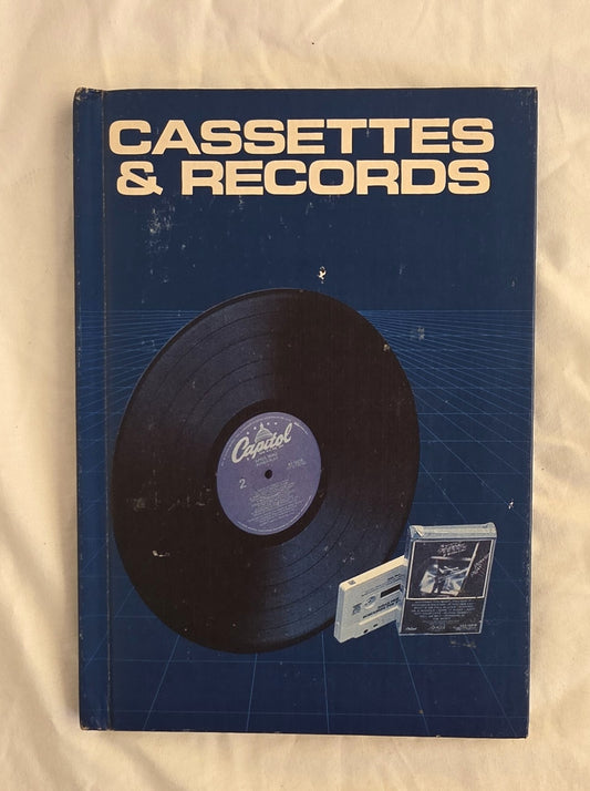 Book cover with a vinyl record and cassette on a blue background