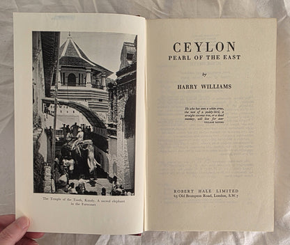 Open book titled 'Ceylon Pearl of the East' by Harry Williams, with a black and white photograph on the left page.