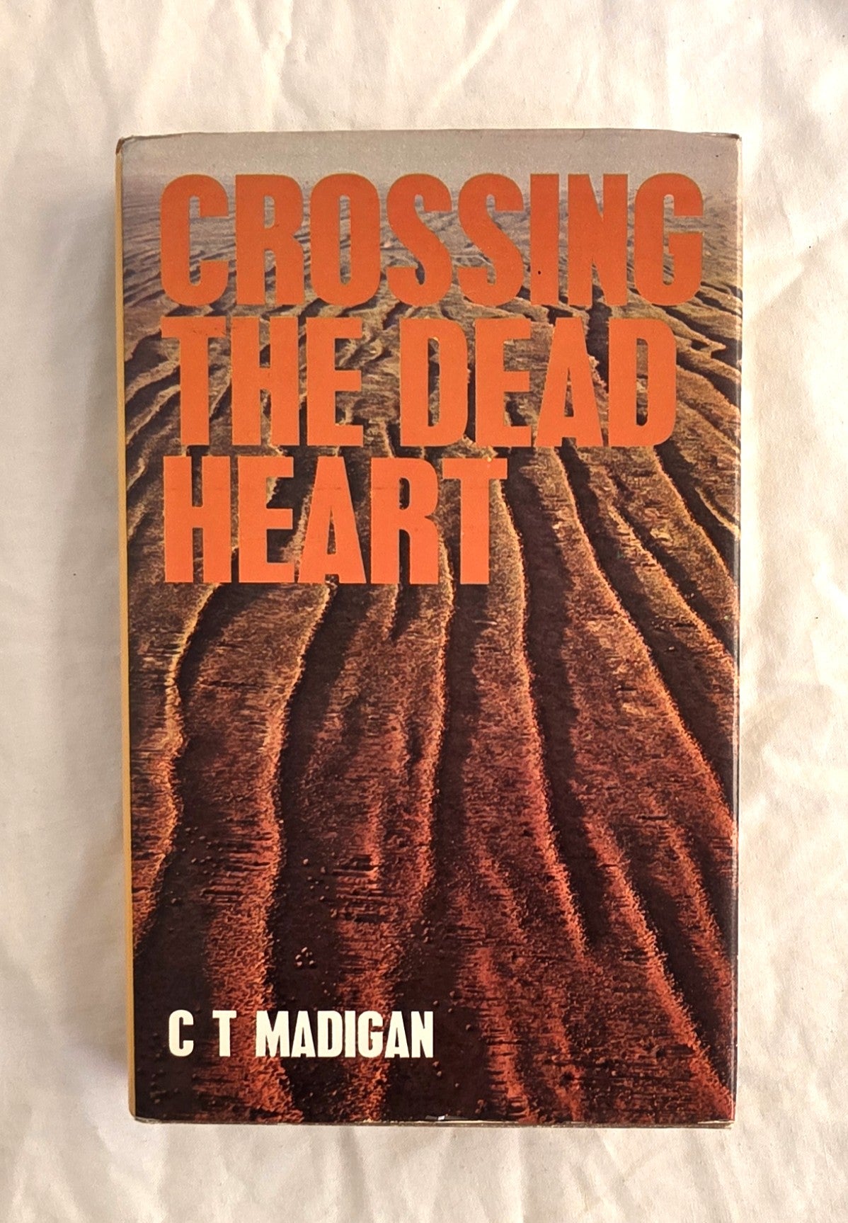 Book cover of 'Crossing the Dead Heart' by C T Madigan on a textured white background
