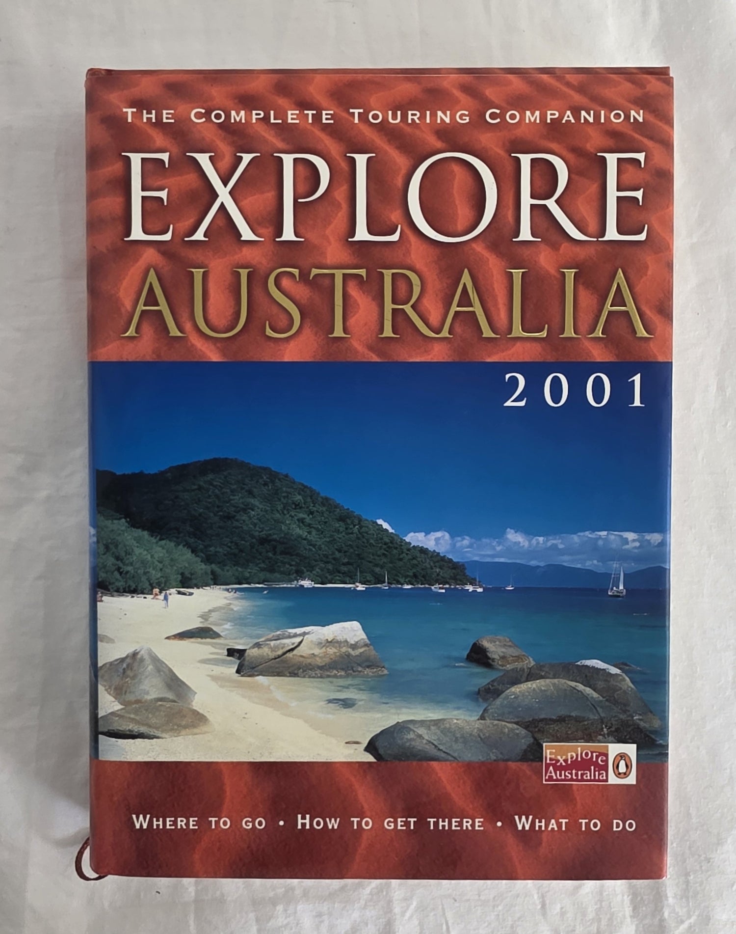 Book titled 'Explore Australia 2001' on a gray background