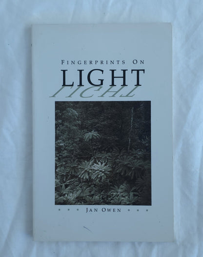 Book titled 'Fingerprints on Light' by Jan Owen on a white background