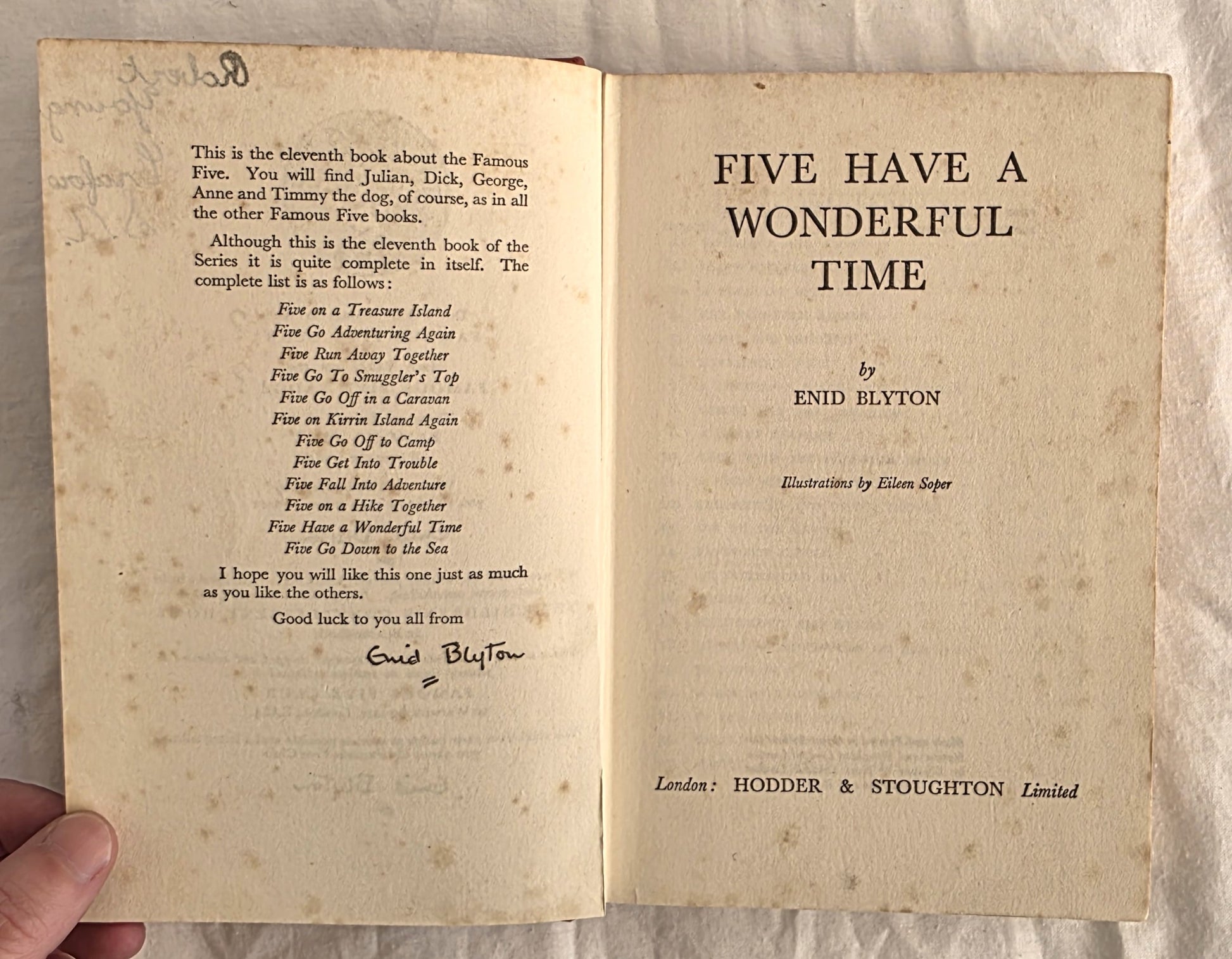 Open book with text on a textured surface