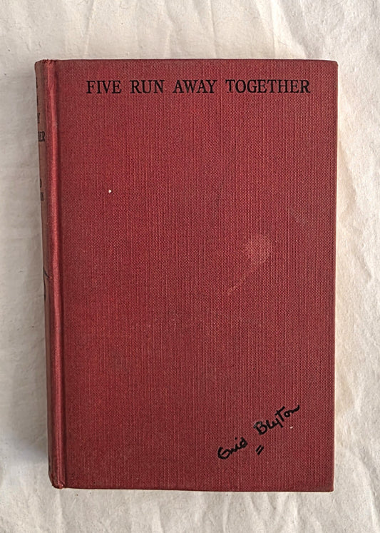 Red book titled 'Five Run Away Together' on a textured white background