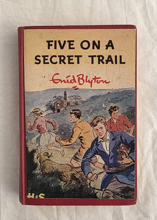 Book cover of 'Five on a Secret Trail' by Enid Blyton with illustration of children and dog.