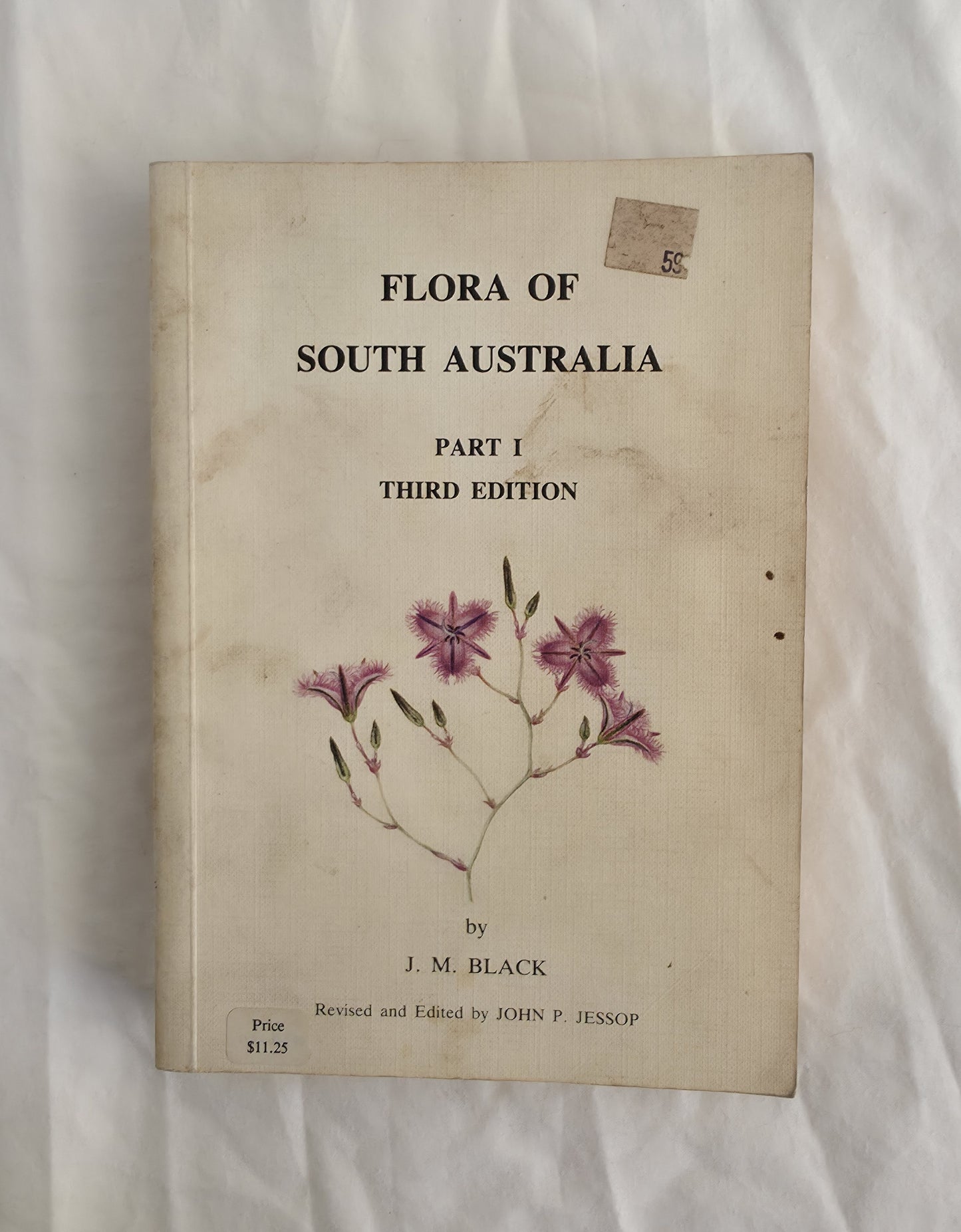 Book titled 'Flora of South Australia' on a white background