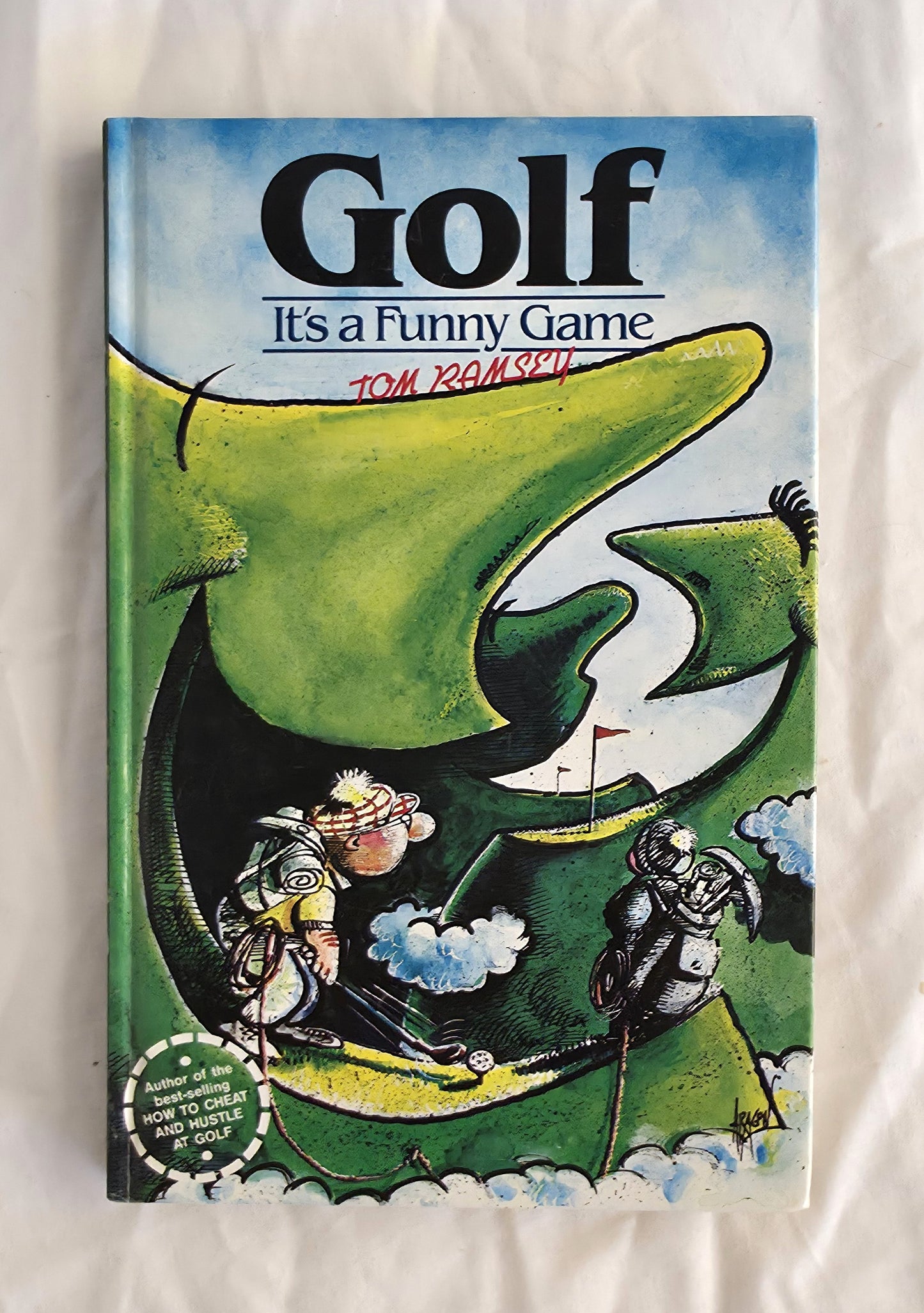 Book cover of 'Golf It's a Funny Game' by Tom Dobasky with cartoon illustration on a white background