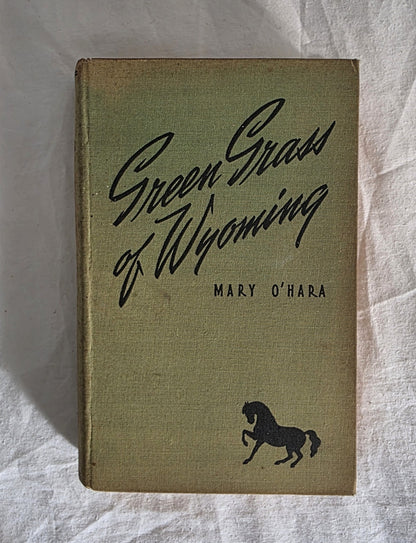 Book titled 'Green Grass of Wyoming' by Mary O'Hara with a horse illustration on a textured white background.