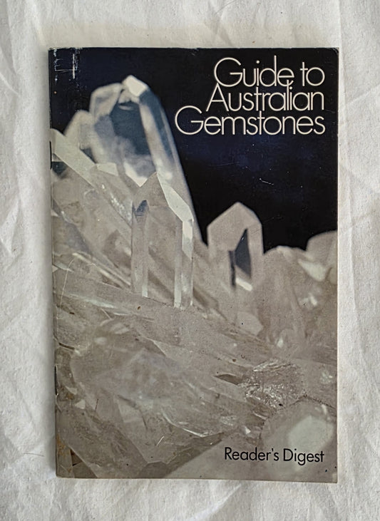 Book titled 'Guide to Australian Gemstones' by Reader's Digest on a textured white background