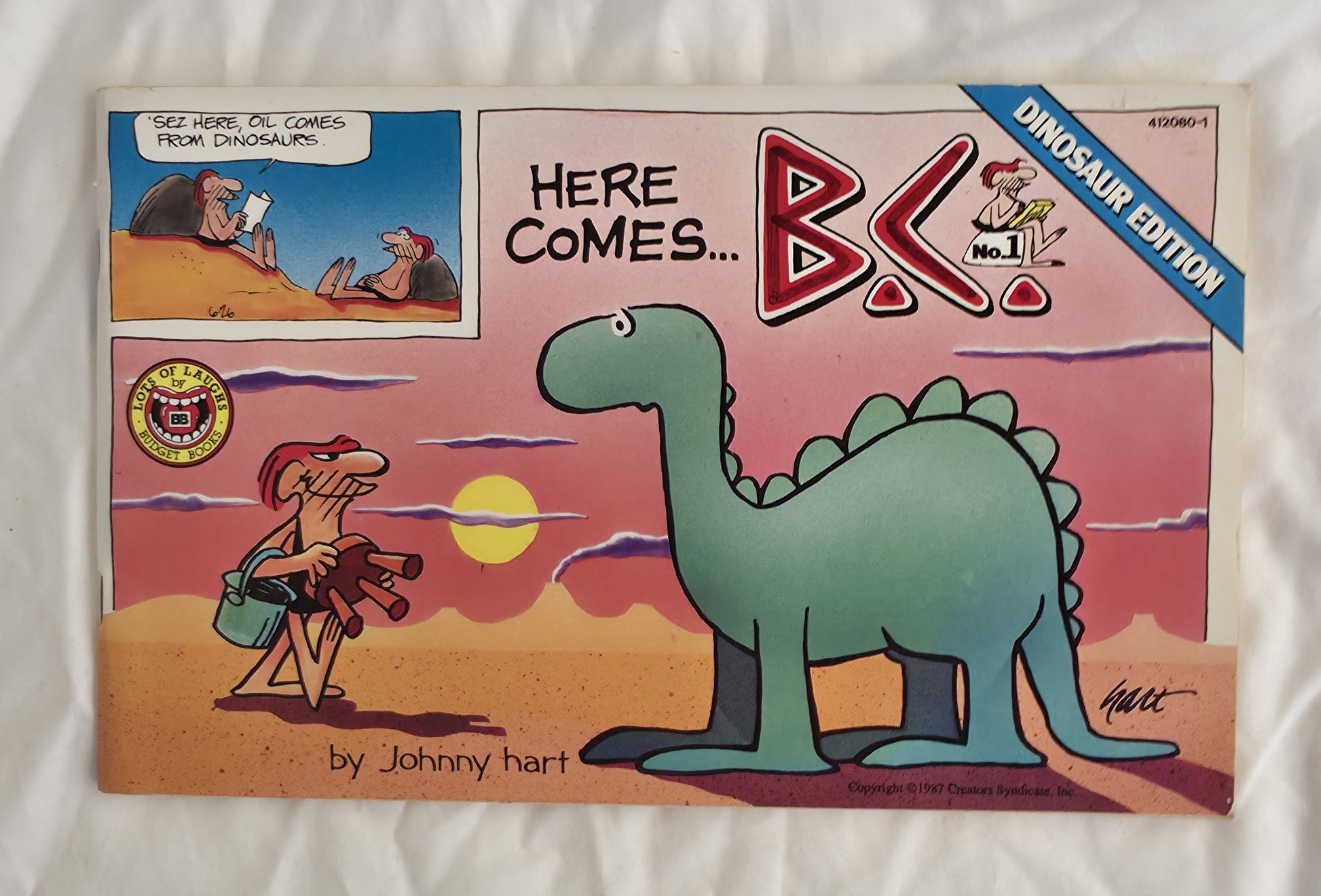 Vintage comic book cover featuring a dinosaur and cartoon characters with 'Here Comes B.K.' branding.