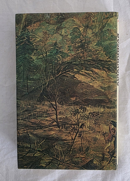 Vintage book cover with nature scene on a textured surface