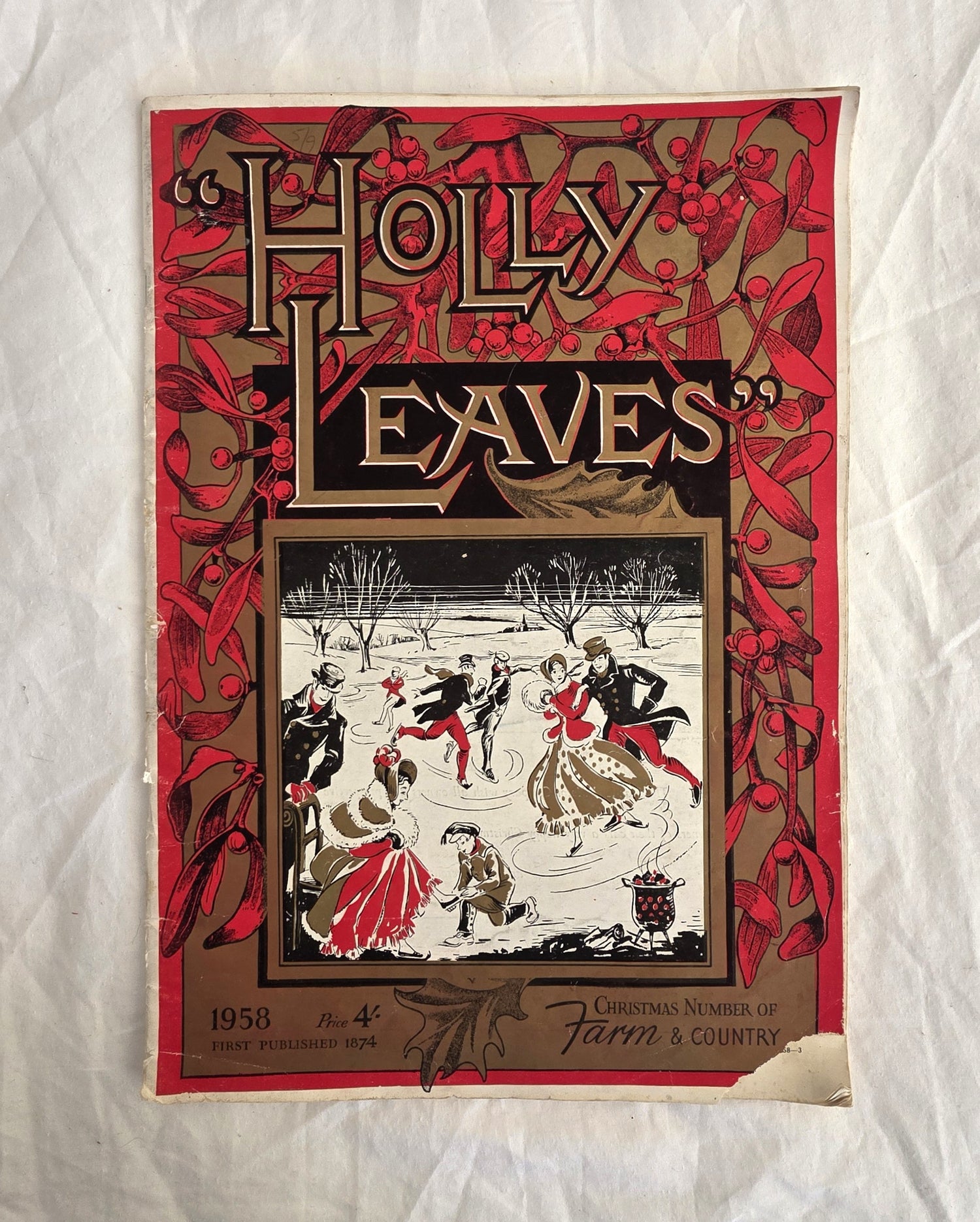 Vintage magazine cover titled 'Holly Leaves' with winter scene illustration on a textured white background