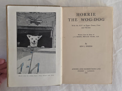 Open book titled 'Horrie the Wog-Dog' with a black and white photo of a dog on the left page.