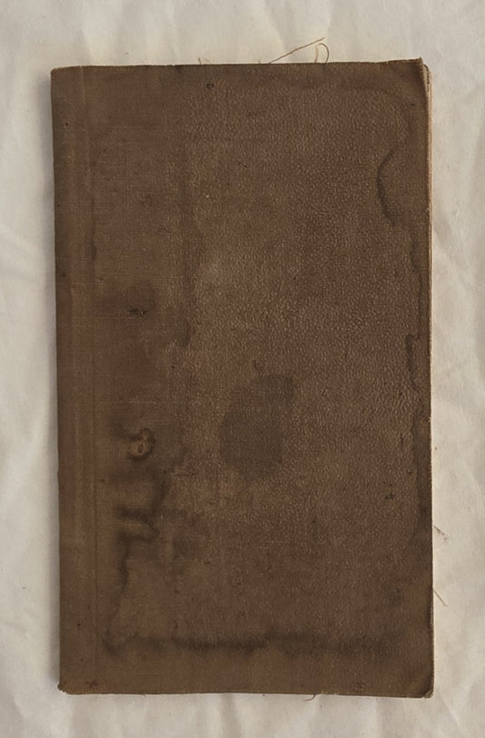 Brown leather-bound book with visible wear on a white background