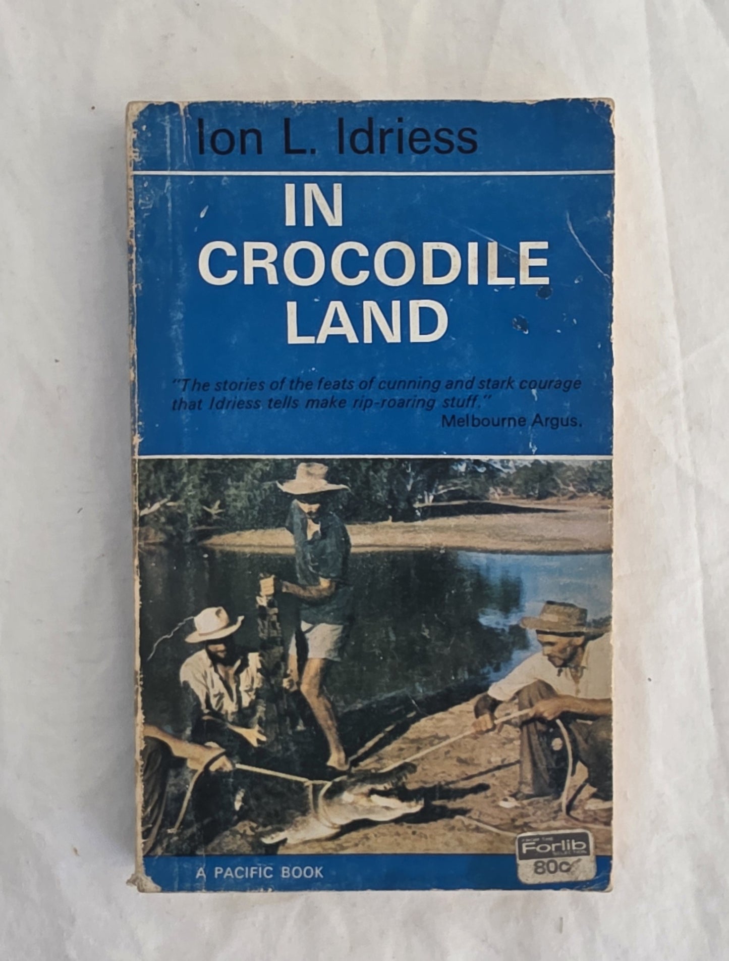 Book cover of 'In Crocodile Land' by Ion L. Idriess on a white background