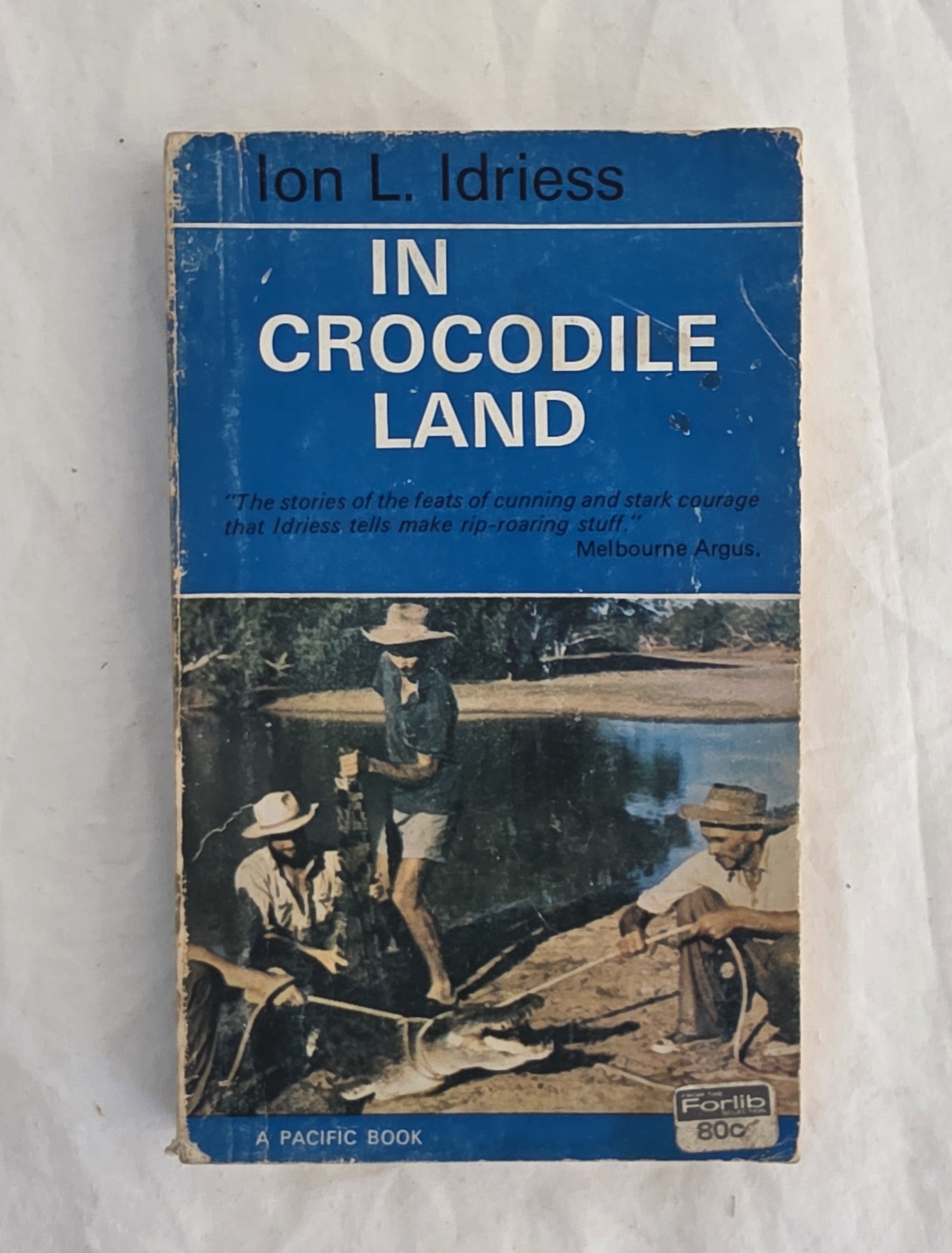 Book cover of 'In Crocodile Land' by Ion L. Idriess on a white background