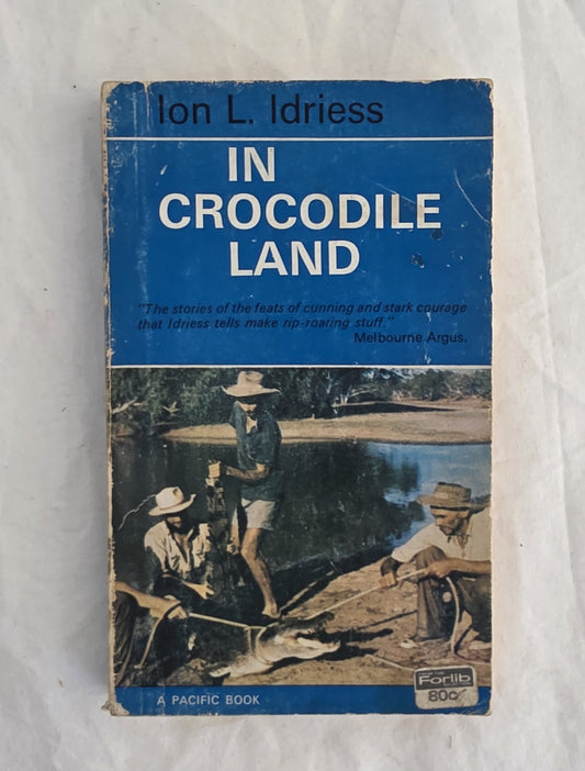 Book cover of 'In Crocodile Land' by Ion L. Idriess on a white background