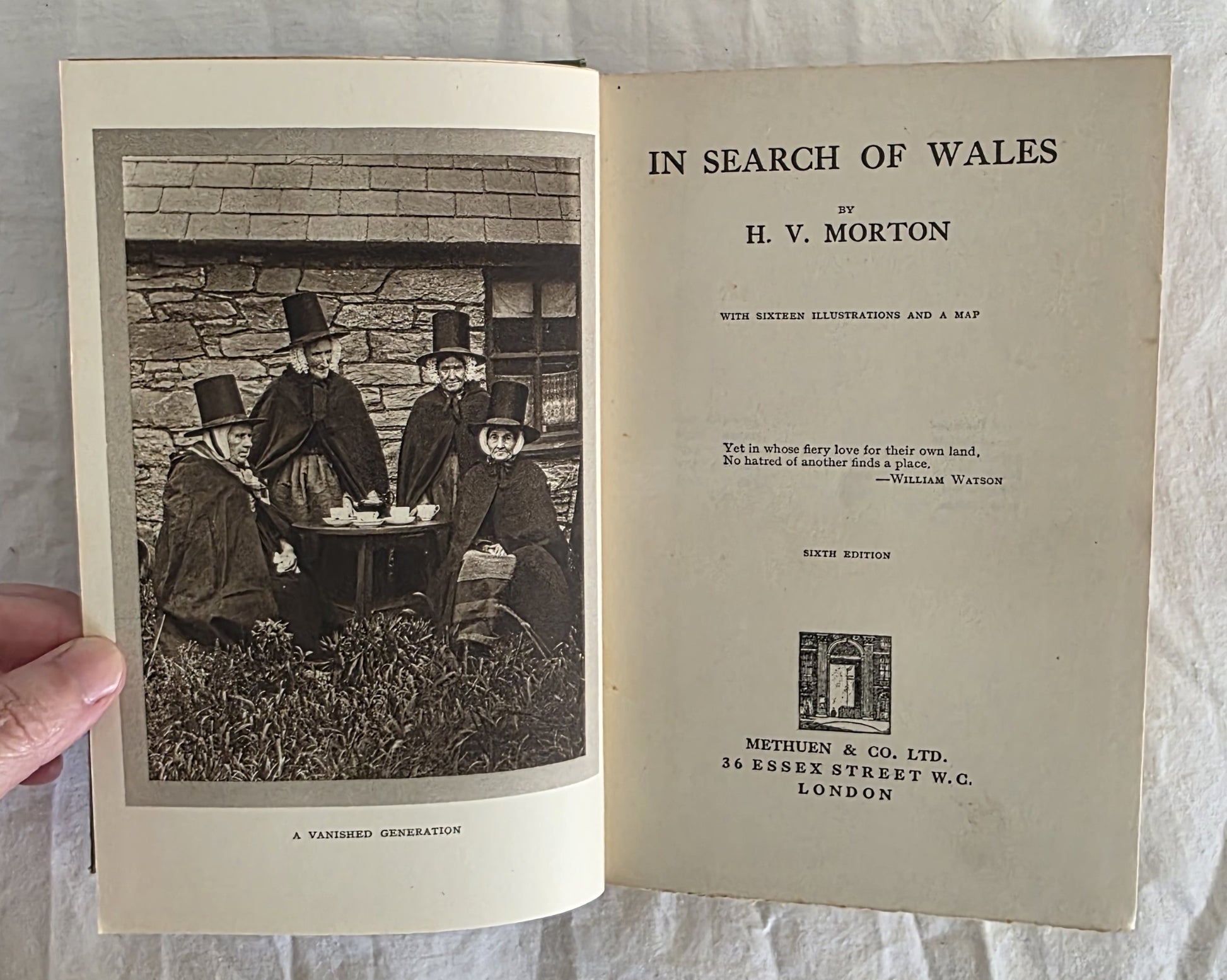 Book titled 'In Search of Wales' by H.V. Morton with a black and white photo on the cover.