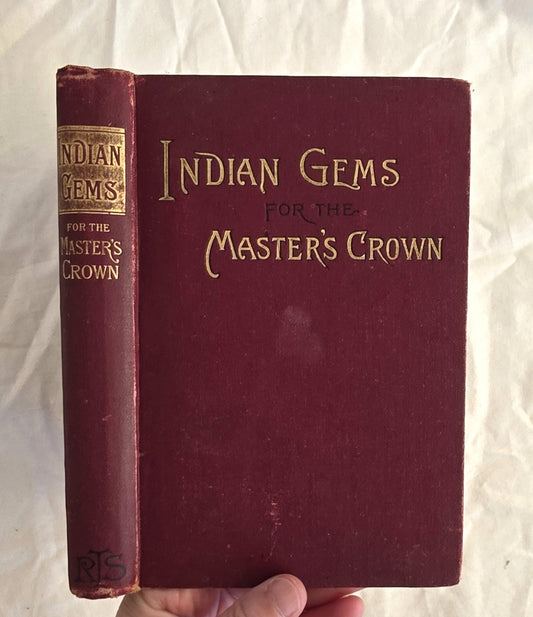 Vintage book titled 'Indian Gems for the Master's Crown' held against a white background
