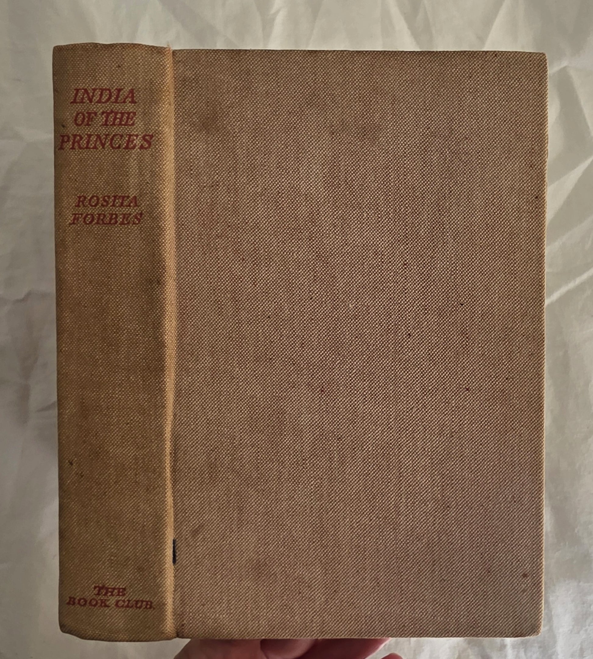 Brown book titled 'India of the Princes' by Rosita Forbes on a textured white background