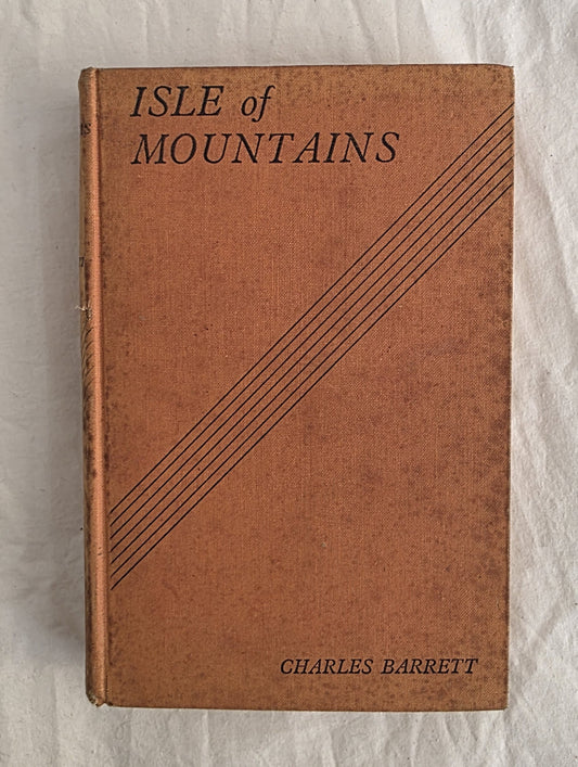 Book titled 'Isle of Mountains' by Charles Barrett on a textured white background