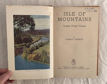 Open book titled 'Isle of Mountains' by Charles Barrett with a scenic illustration on the cover.
