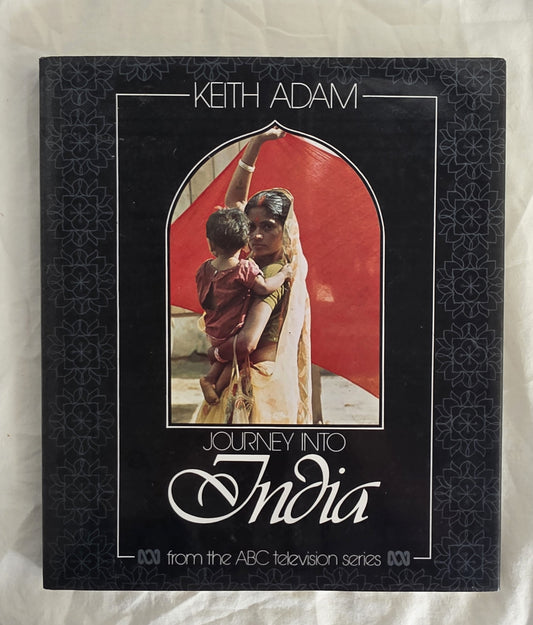 Book cover titled 'Journey into India' by Keith Adam on a textured surface