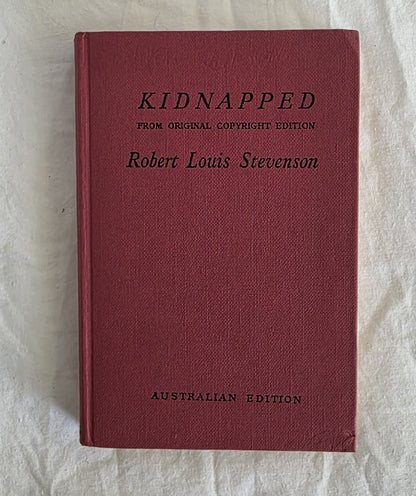 Red book titled 'Kidnapped' by Robert Louis Stevenson on a light background