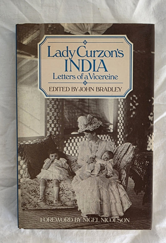 Book cover of 'Lady Curzon's India: Letters of a Vicereine' with a woman holding a child on a couch.